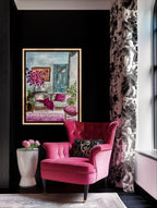 Pink armchair in a room with a floral painting and decorative elements. Laura K Aiken Studio