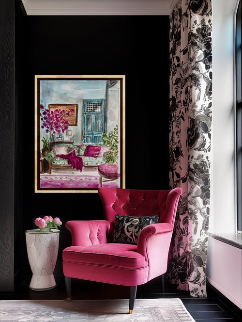 Pink armchair in a room with a floral painting and decorative elements. Laura K Aiken Studio