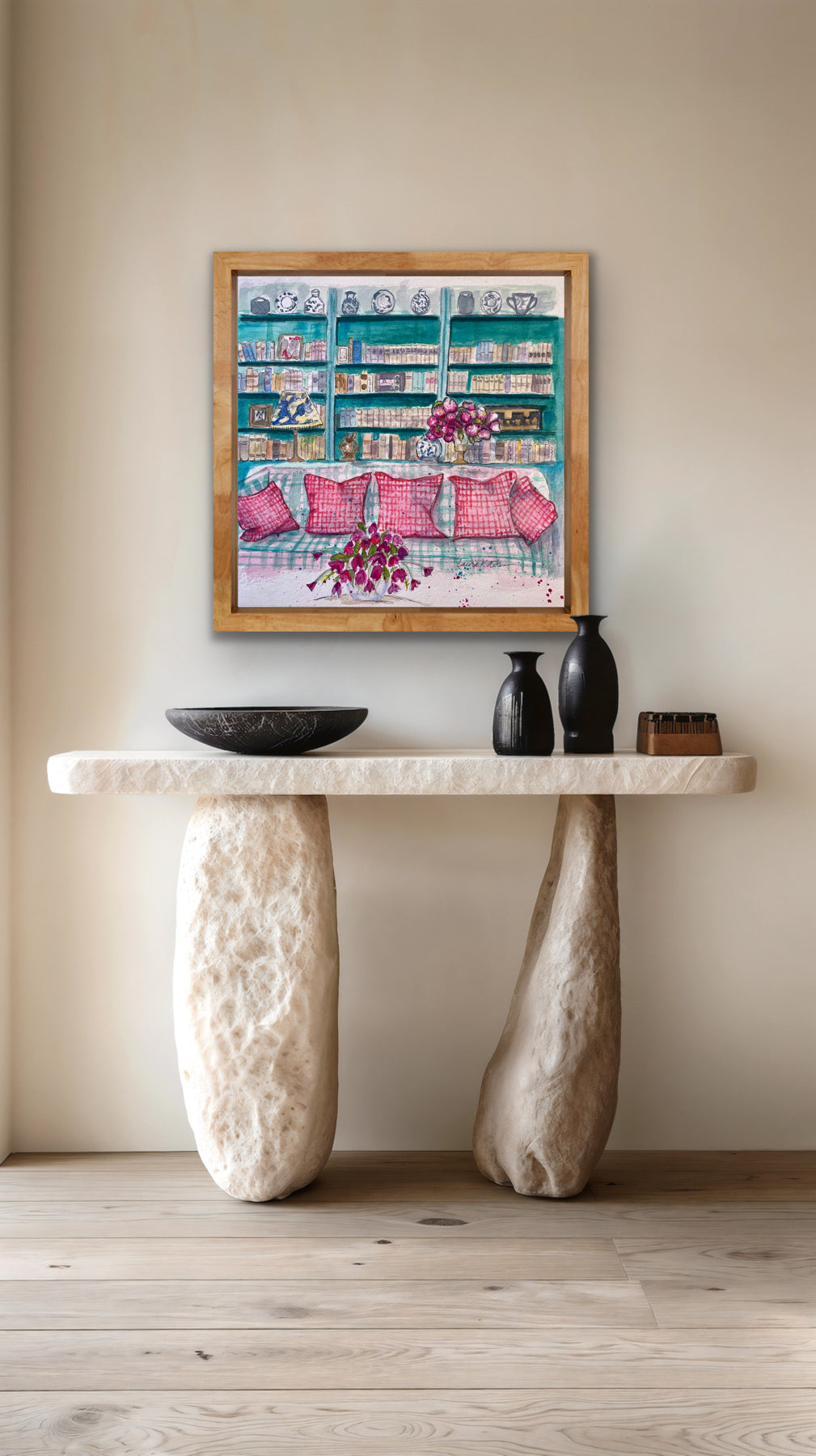 Stylish interior with a stone console table, decorative items, and a framed painting on a beige wall.