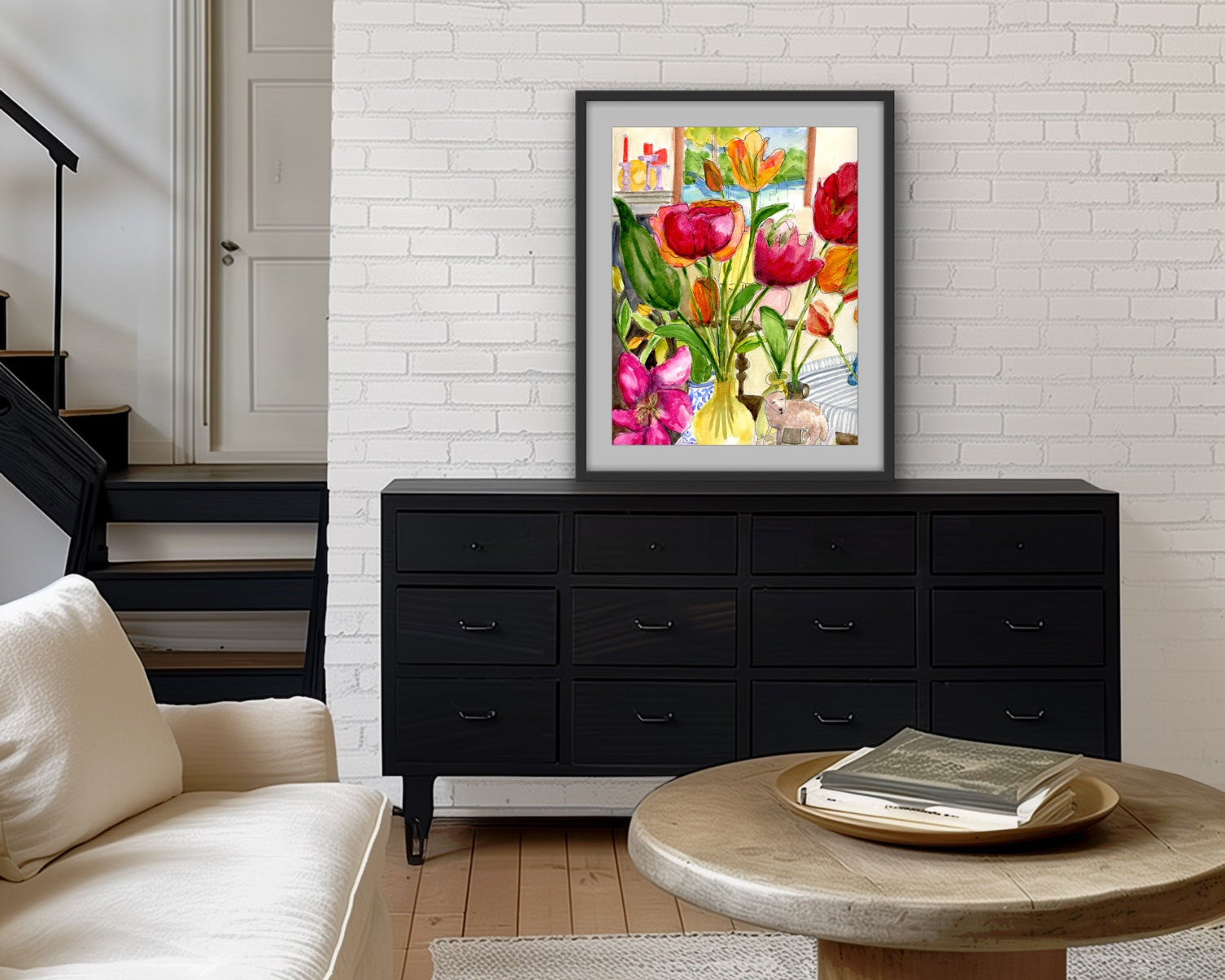 A mock up of Laura K Aiken watercolor showing in a room of black and white. Florals and colors are dominate 
