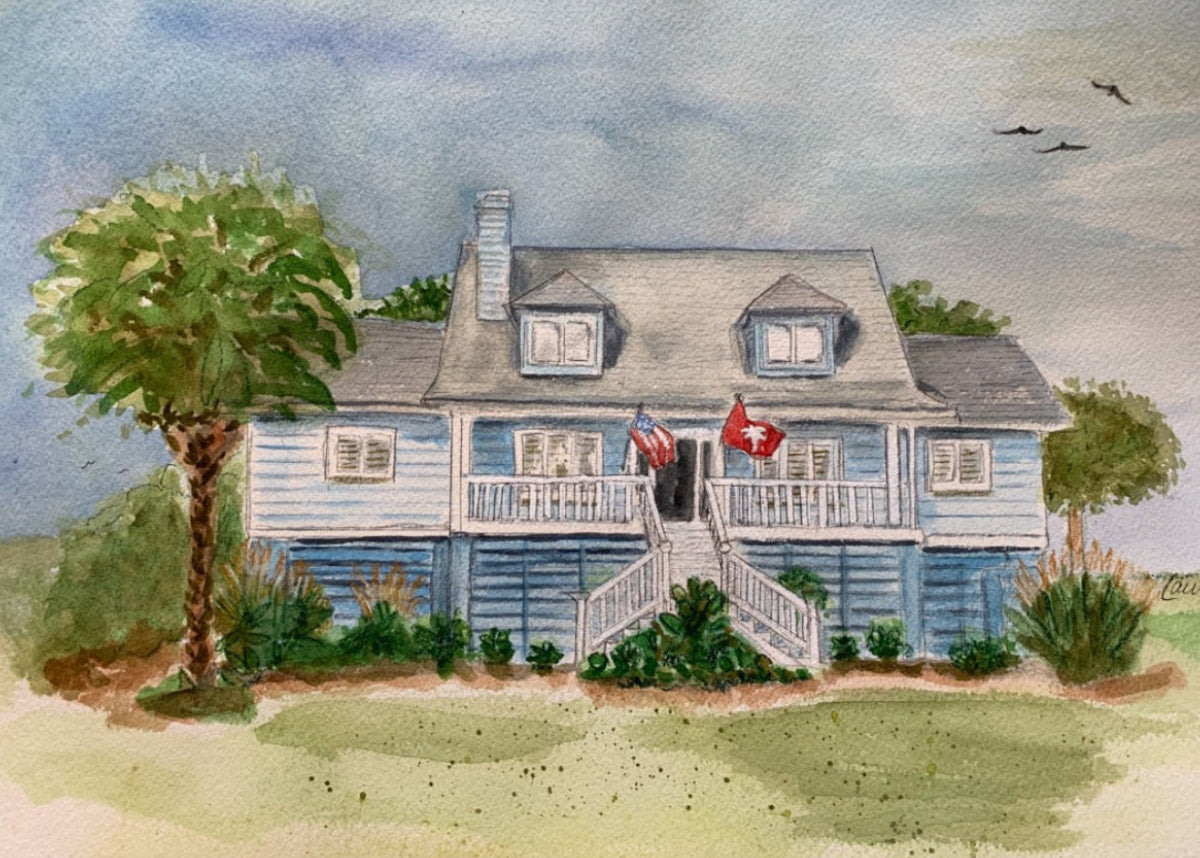 Watercolor painting of a blue house with a porch and flags, surrounded by trees and grass. Laura K Aiken artist