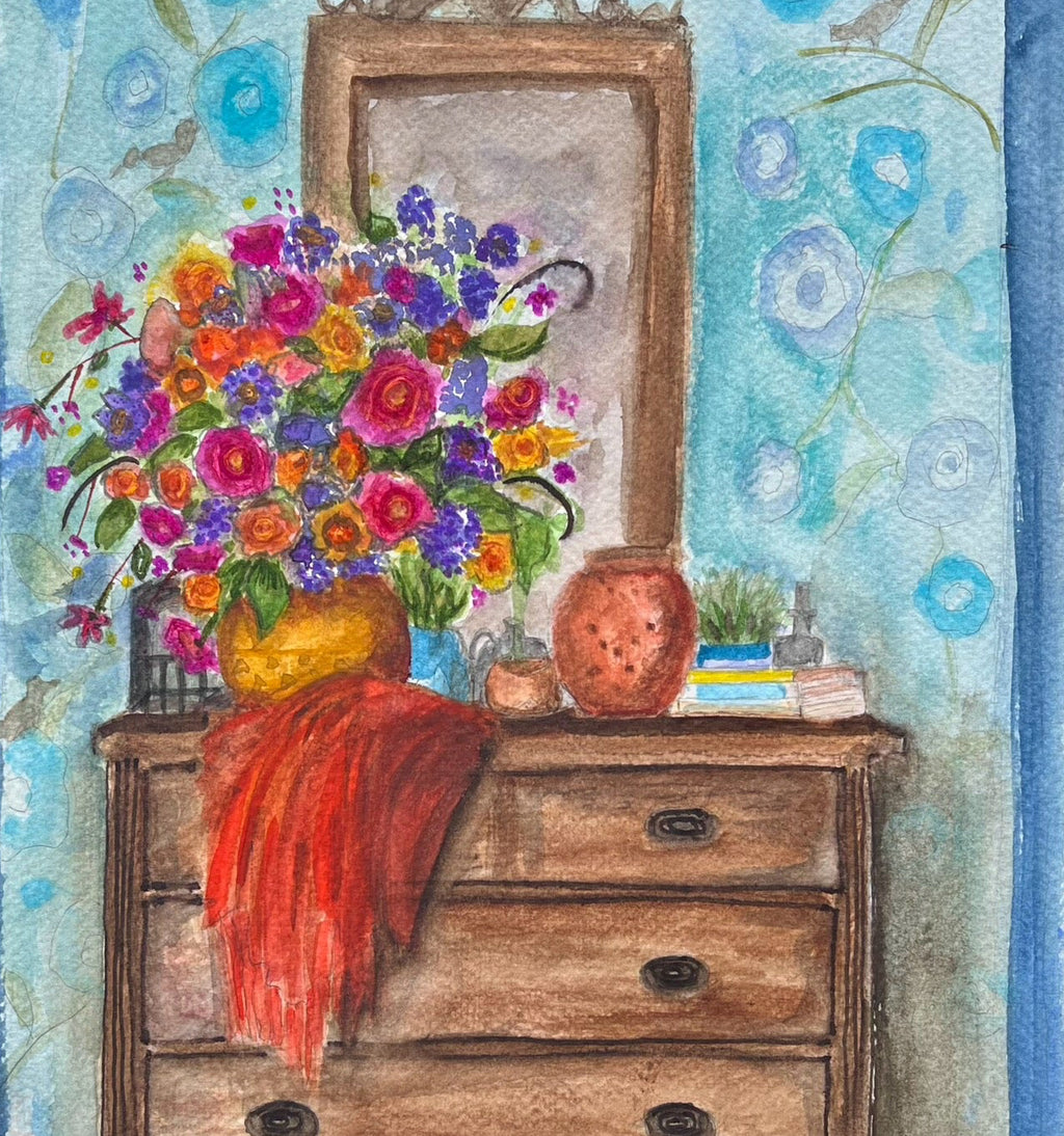 Watercolor painting of a wooden dresser with flowers and a mirror, against a floral-patterned wall. Artist Laura K Aiken